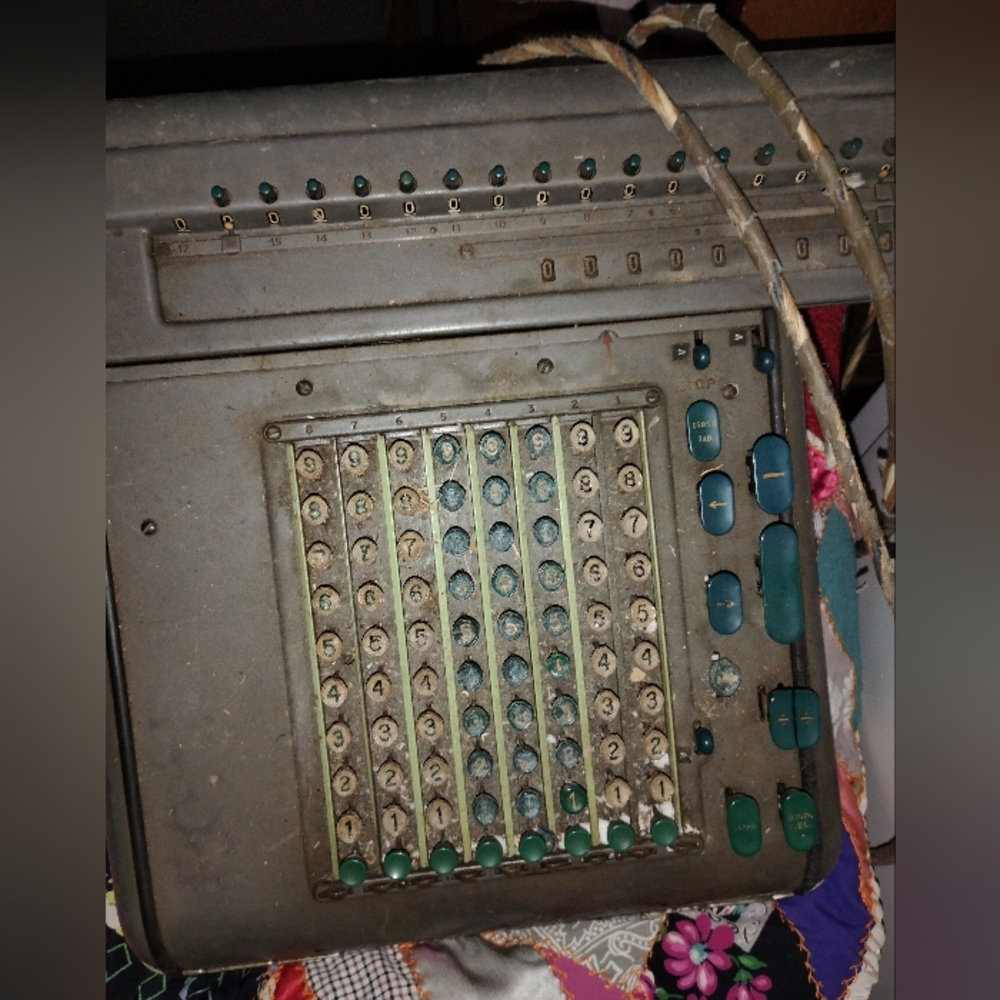 Vintage Mechanical Calculator with Green Accents retro office
